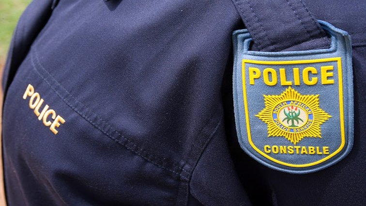 Close-up of a South African Police Service (SAPS) officer's uniform and badge, used to illustrate the question "Is SAPS a Notary Public?" in South Africa.
